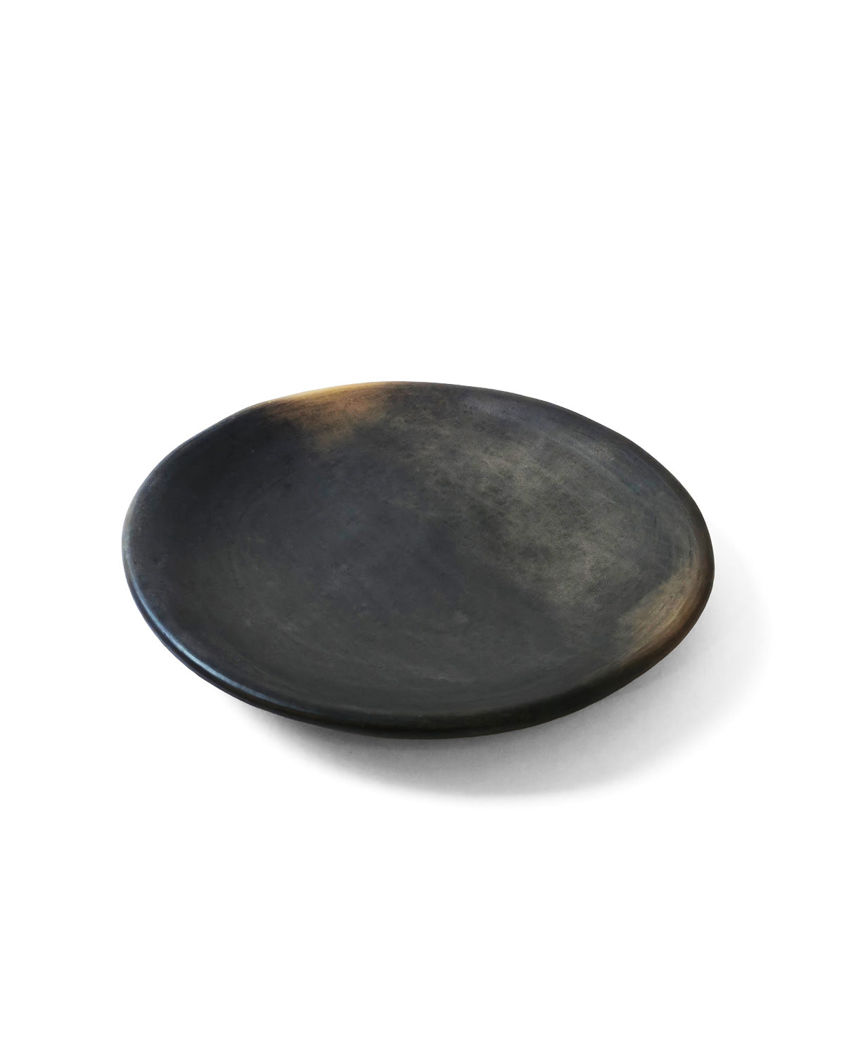 Side profile of the handmade Oaxacan Platter with shallow curved edges.