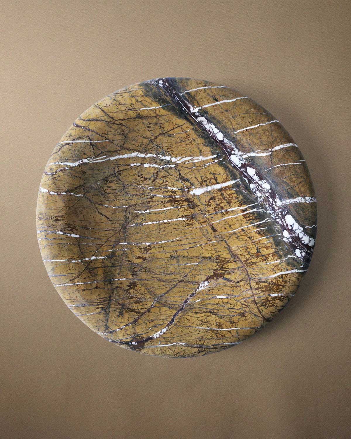Brown marble decorative tray on a beige background