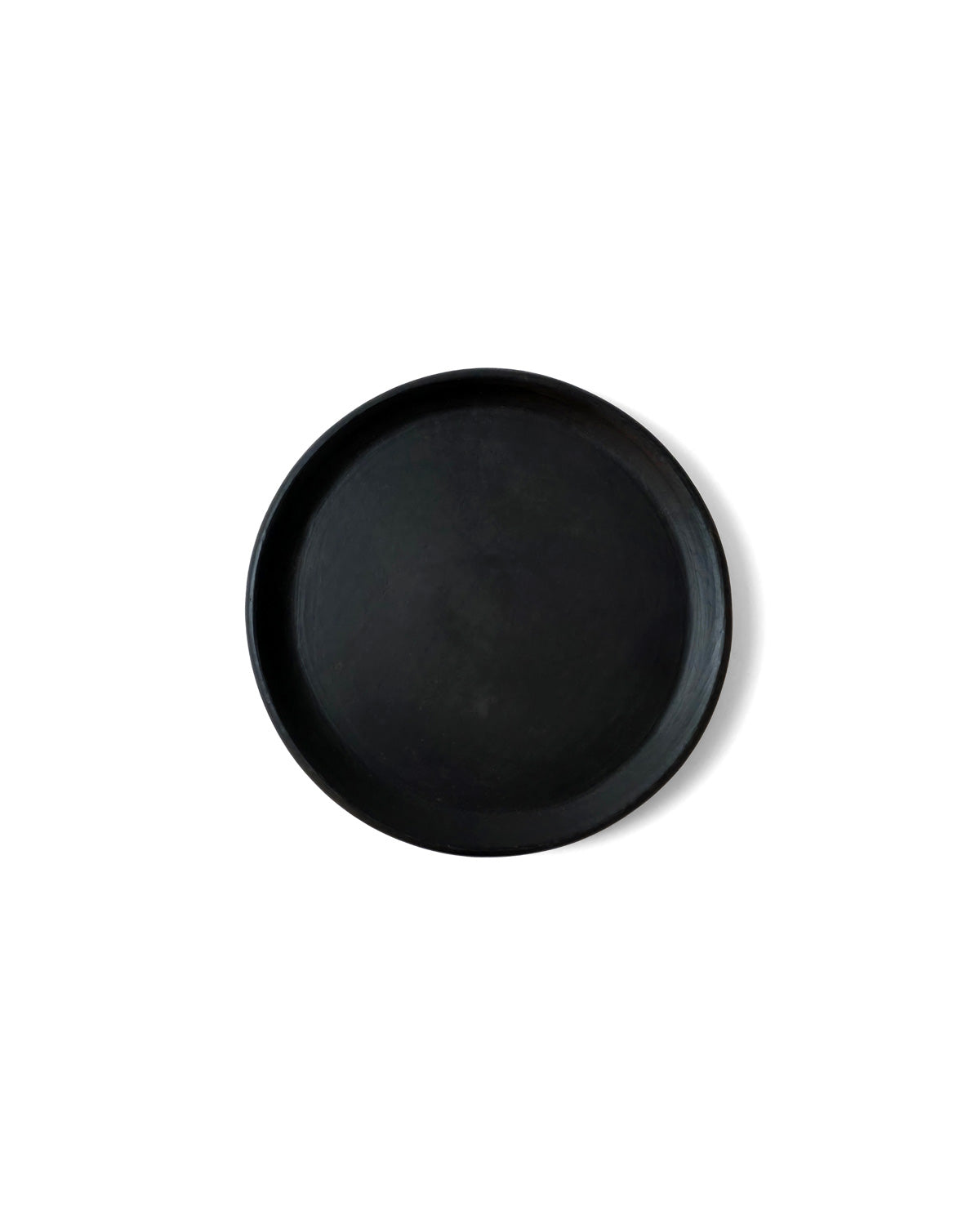 Top-view of Oaxacan black clay appetizer plate.