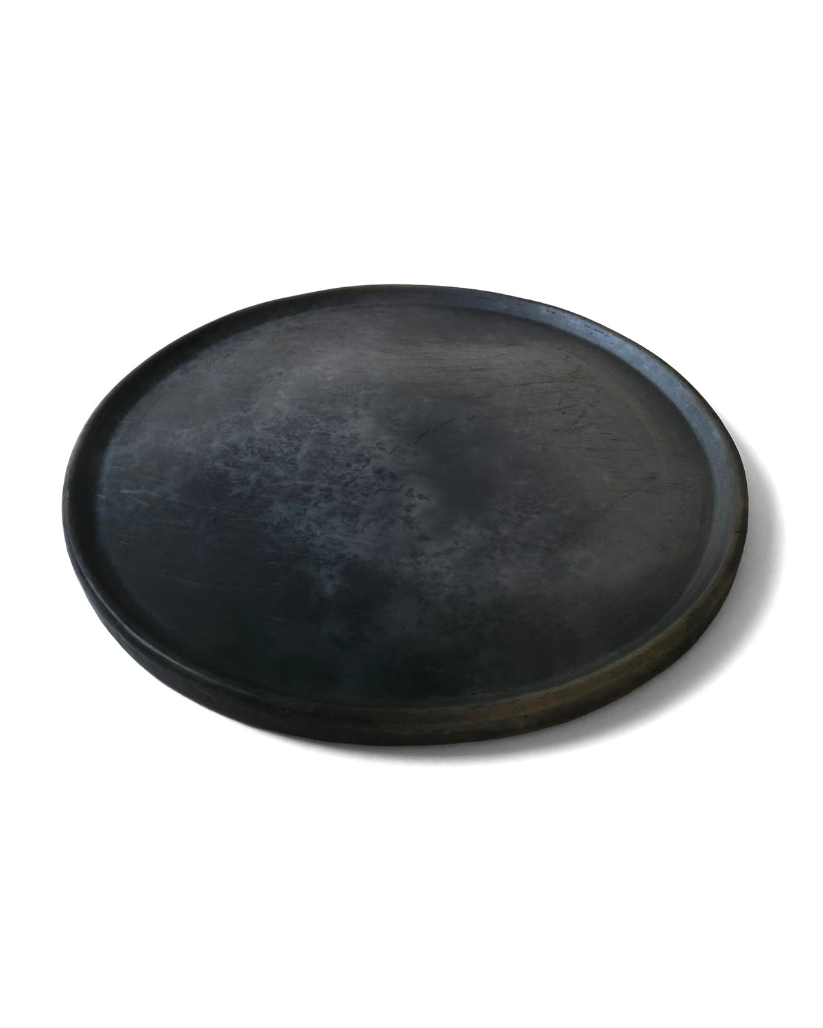Side-angle of Oaxacan black clay serving platter.