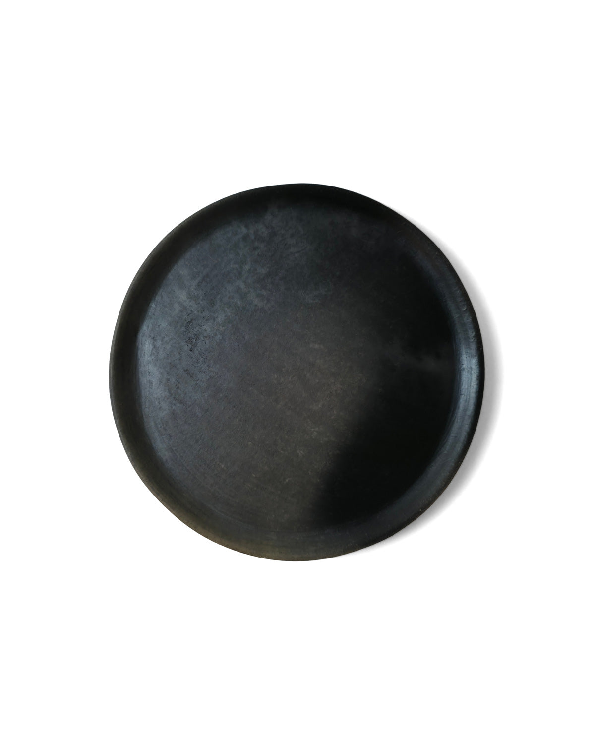 Top view of Oaxacan black clay salad plate.