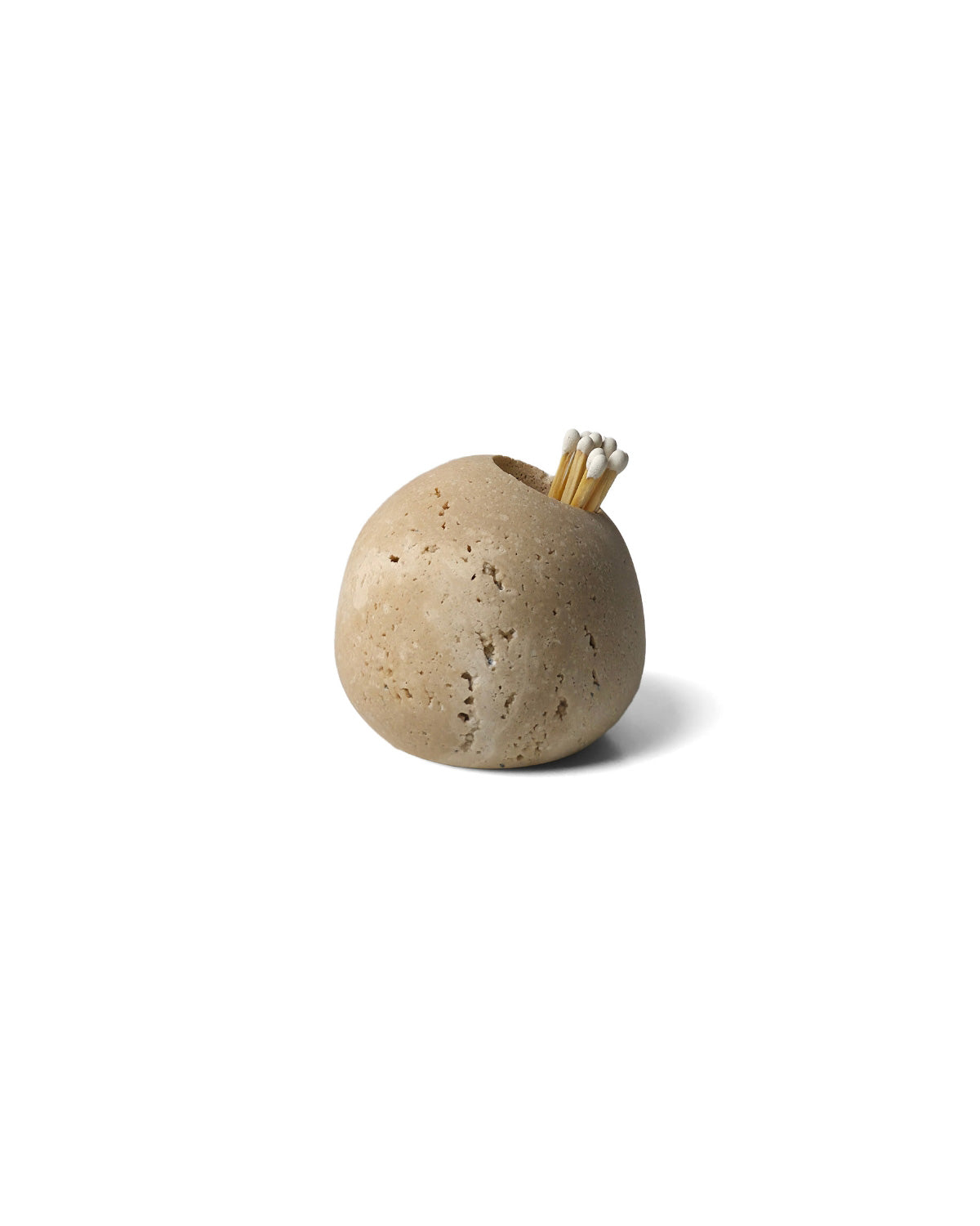 Roca Match Holder made from beige travertine, styled with matchsticks