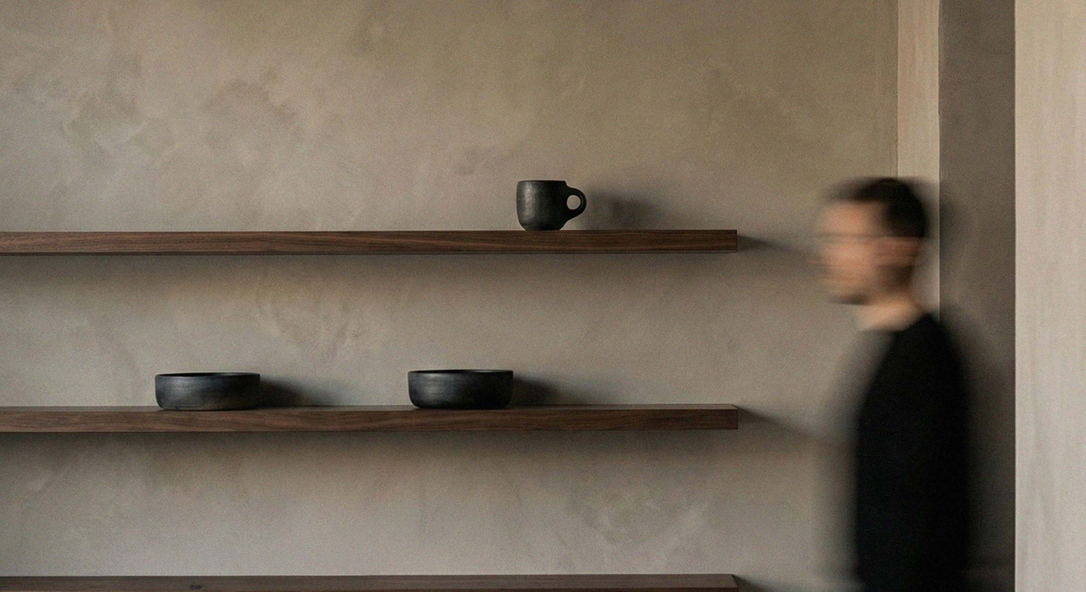 Seasonal Refresh - minimalist shelves with handmade pottery.